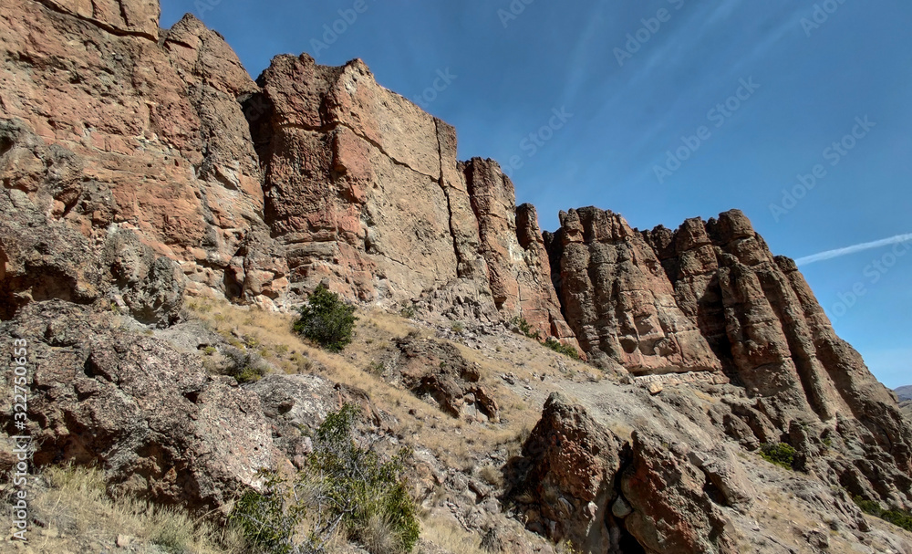 The amazing badlands and palisades of the John Day Fossil Beds clarno unit and rock formations in a semi desert landscape in Oregon State