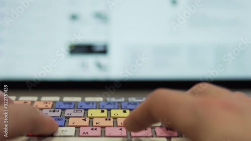 Slow Motion: Typing on Editing Keyboard in Front of Modern Display