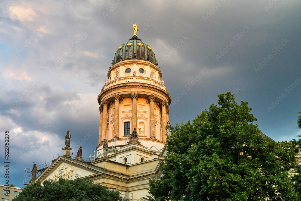 View of famous Gendarmenmarkt square at sunset in Berlin, Germany
