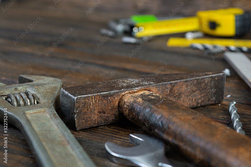 Set of working tools on wooden rustic background. Top view. Copy space Set of working tools on wooden rustic background. Top view. Copy space