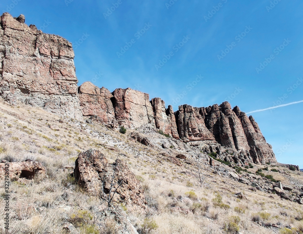 The amazing badlands and palisades of the John Day Fossil Beds clarno unit and rock formations in a semi desert landscape in Oregon State The amazing badlands and palisades of the John Day Fossil Beds clarno unit and rock formations in a semi desert landscape in Oregon State