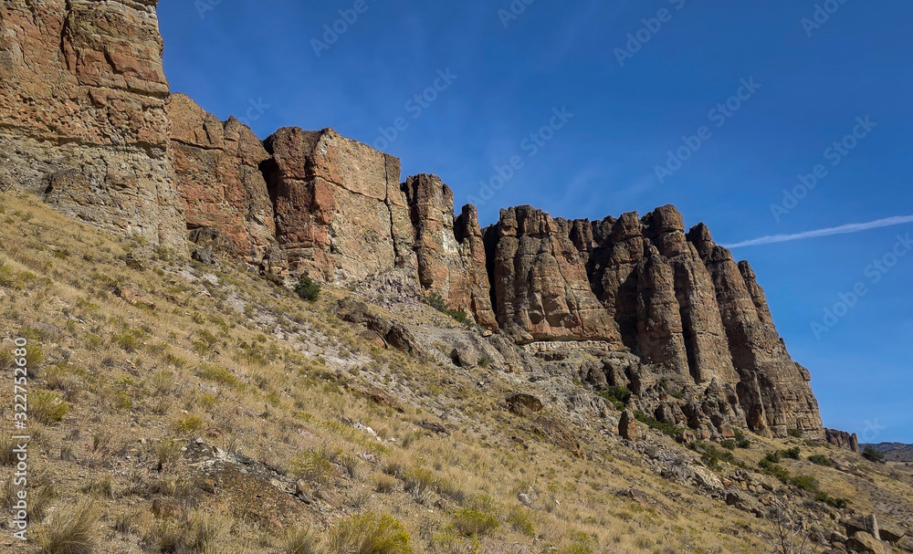 The amazing badlands and palisades of the John Day Fossil Beds clarno unit and rock formations in a semi desert landscape in Oregon State The amazing badlands and palisades of the John Day Fossil Beds clarno unit and rock formations in a semi desert landscape in Oregon State