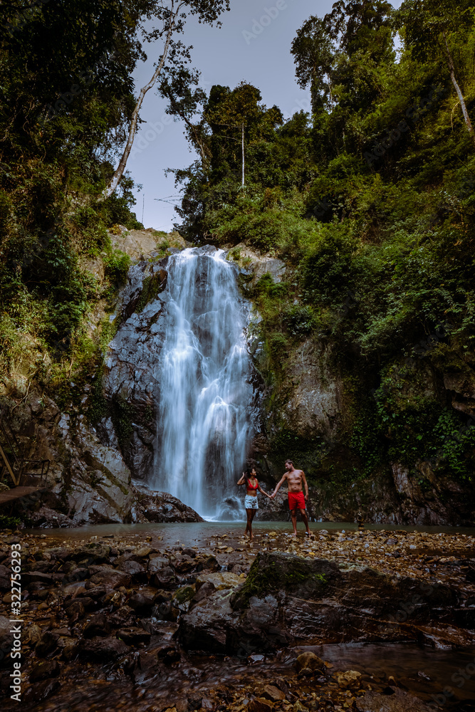 Fototapeta A tourist is enjoying the beauty of the waterfall in Chumphon province, Thailand , Klongphrao waterfall Thailand