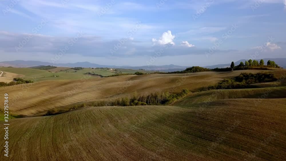 Open fields of the Tuscan countryside near Florence, Italy on a cloudy day, Aerial flyover reveal shot Open fields of the Tuscan countryside near Florence, Italy on a cloudy day, Aerial flyover reveal shot