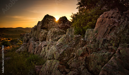 Rocks in the mountain landscape and sun rays during sunset in Almodovar del Campo  Spain