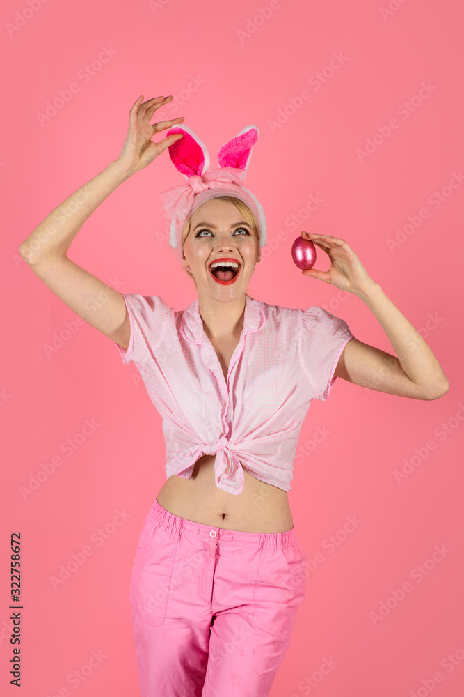 Happy Easter. Blonde girl holds color egg. Spring holiday. Smiling woman in rabbit bunny ears. Happy woman preparing for Easter. Pretty girl hunts for Easter eggs. Hunting eggs. Easter. Happy Easter. Blonde girl holds color egg. Spring holiday. Smiling woman in rabbit bunny ears. Happy woman preparing for Easter. Pretty girl hunts for Easter eggs. Hunting eggs. Easter.
