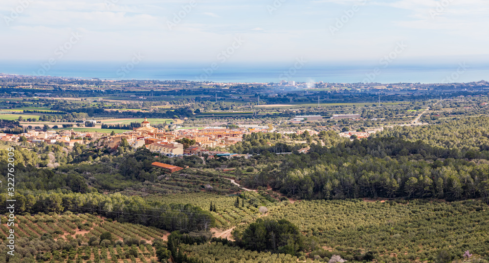 Panoramic view of Mont-roig and the Costa Dorada seen from the Sanctuary of La Mare de Deu of Roca, Catalonia, Spain