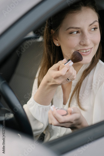 Brush for blush. Violations of the law by a female driver in transport. Glamour and beauty