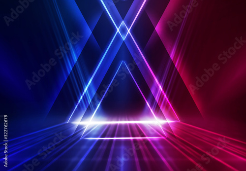 Dark abstract futuristic background. Geometric laser figure in the center of the stage. Neon blue-pink rays of light on a dark background