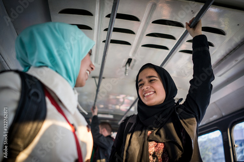 Ταπετσαρία Mother and daughter riding public transport in city
