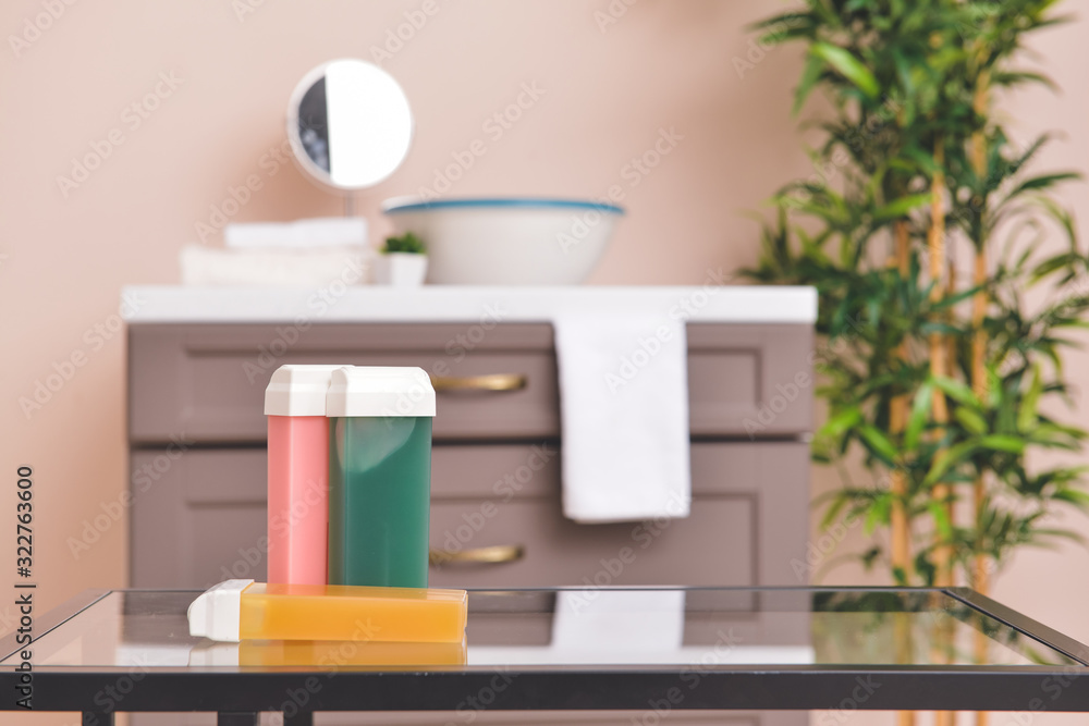 Liposoluble wax cartridges on table in bathroom Liposoluble wax cartridges on table in bathroom