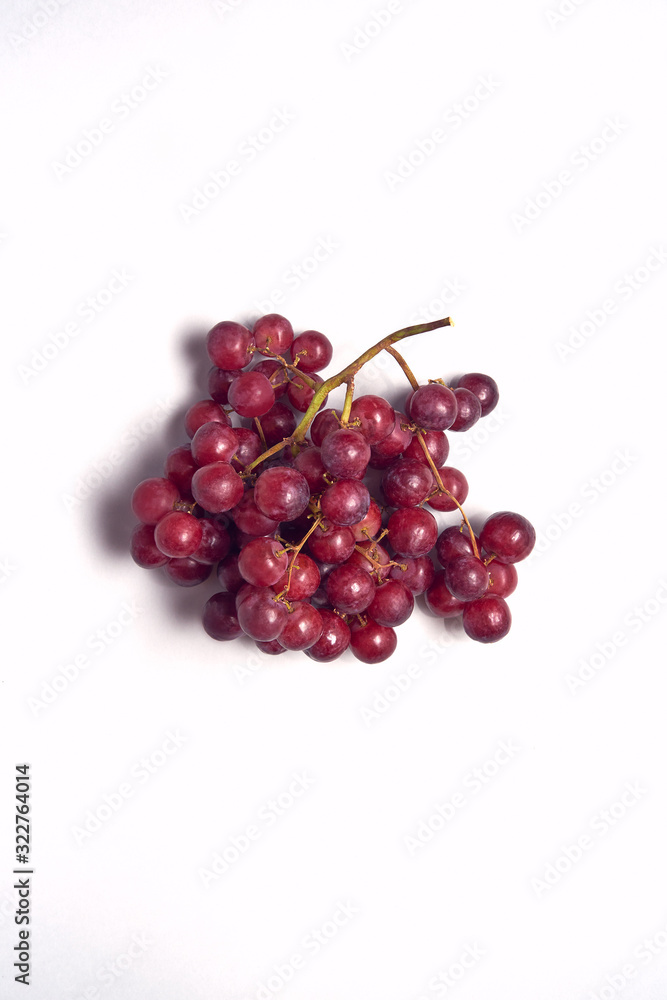 Overhead View Of Bunch Of Red Grapes On White Background Overhead View Of Bunch Of Red Grapes On White Background