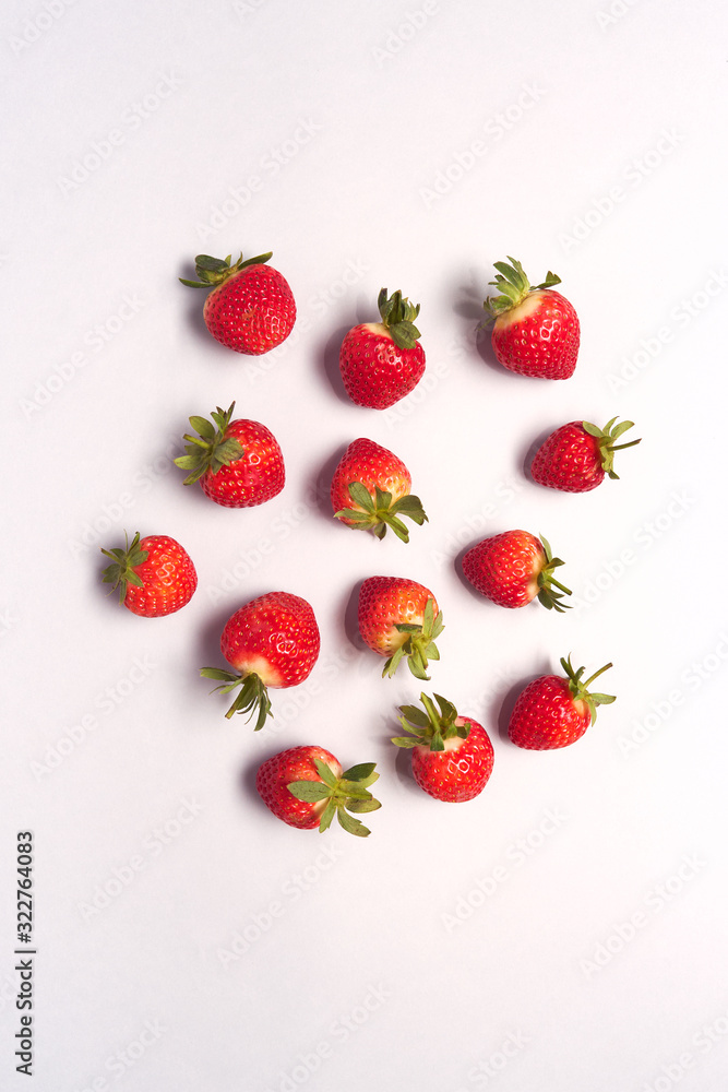 Overhead View Of Individual Fresh Strawberries On White Background Overhead View Of Individual Fresh Strawberries On White Background