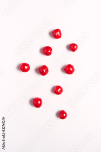 Overhead View Of Individual Fresh Tomatoes On White Background