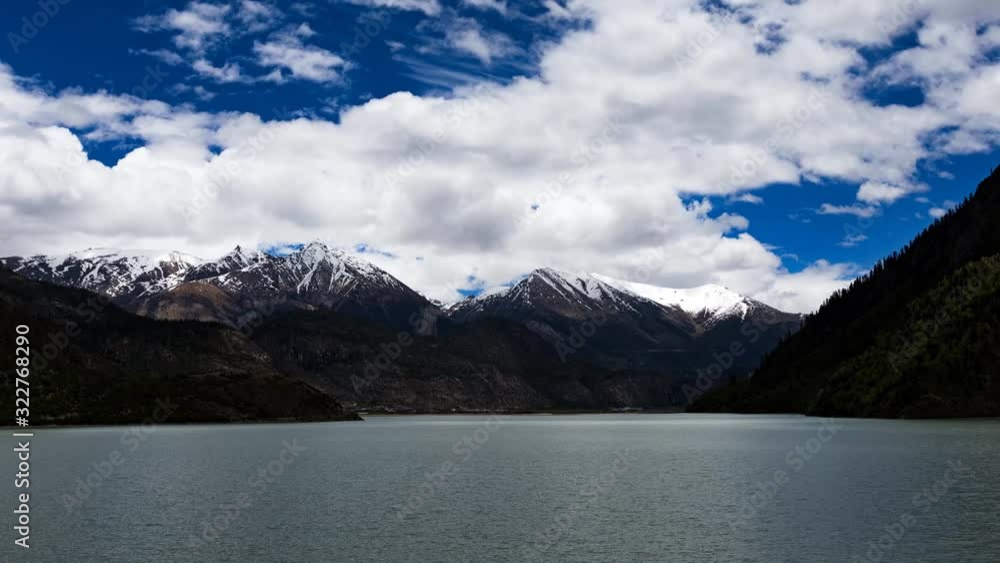 The timelapse of the layer of mountains next to the lake The timelapse of the layer of mountains next to the lake