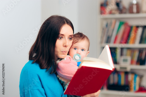 Funny Mother Reading Fairytale Book To her Baby