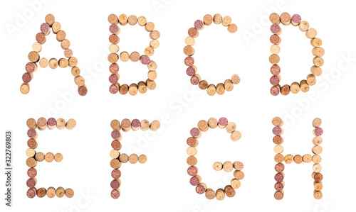 Set of letters from wine corks, alphabet isolated on a white background.