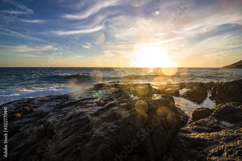 Splashes of waves on the rocky seashore