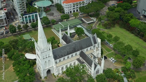 flight over singapore city day time central famous cathedral aerial panorama 4k  photo