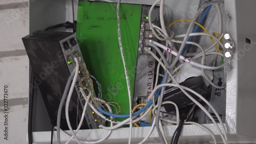 Computer network. Data cables are connected to the router. Close-up. High speed internet. Switch cabinet. Tangled Cords
