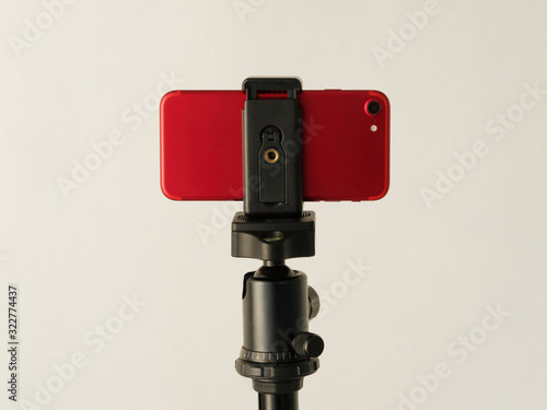 Using smartphone like professional photo camera on tripod.