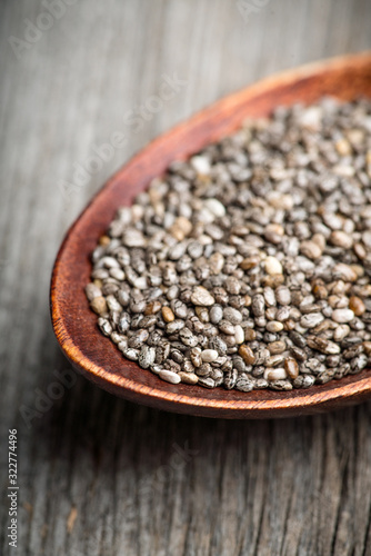 Chia seeds on the wooden table. Selective focus. shallow depth of field.