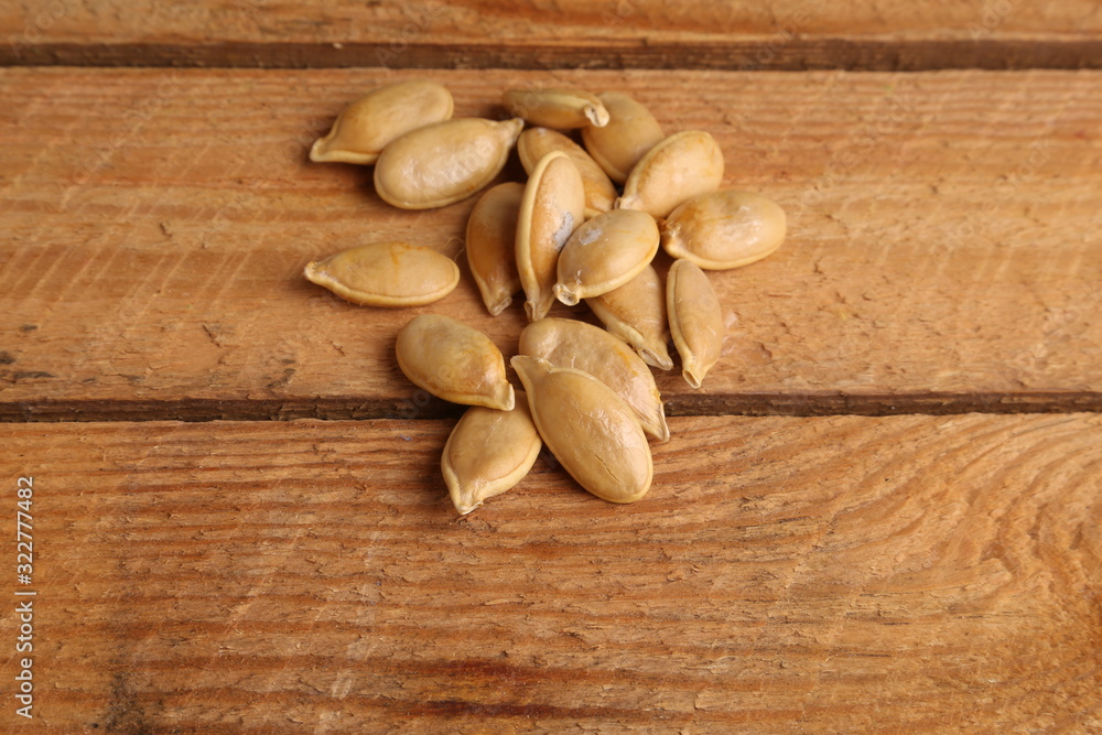 pumpkin seeds on color background pumpkin seeds on color background