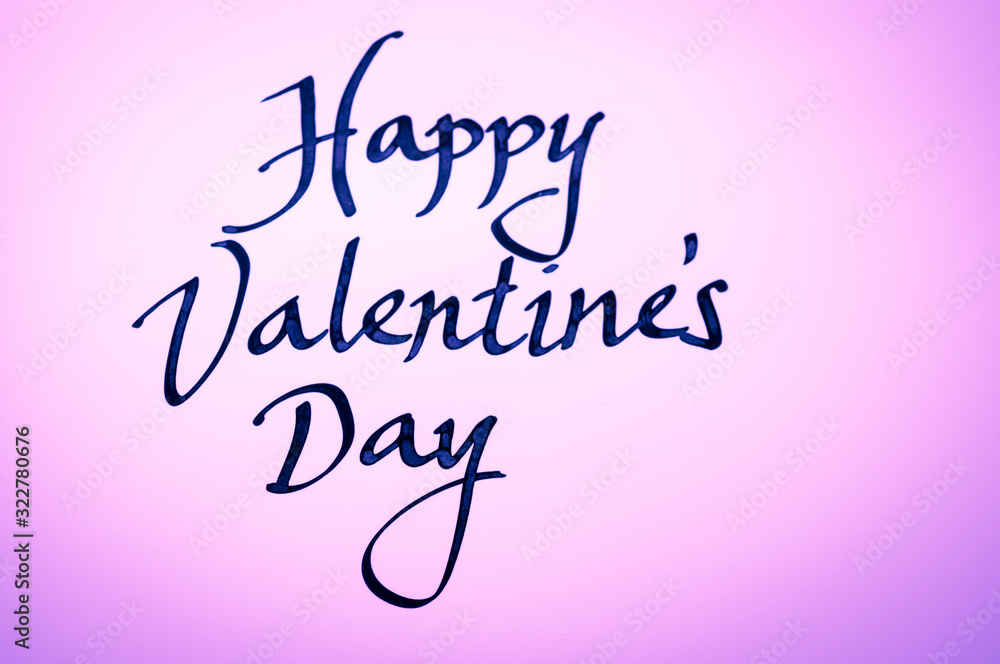 Handwritten Happy Valentine's Day message in simple calligraphic script on glowing pink background