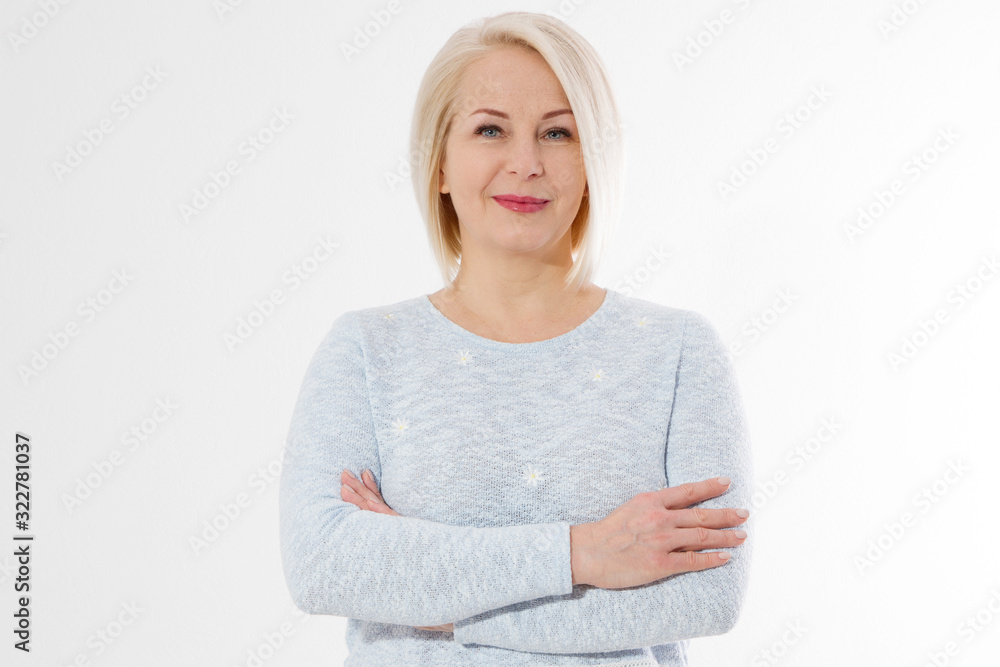 Happy beautiful close up portrait middle age blonde woman. Mid aged healthy female isolated on white background with copy space. Menopause and healthcare. Mature lady wrinkled face. Folded hands Happy beautiful close up portrait middle age blonde woman. Mid aged healthy female isolated on white background with copy space. Menopause and healthcare. Mature lady wrinkled face. Folded hands