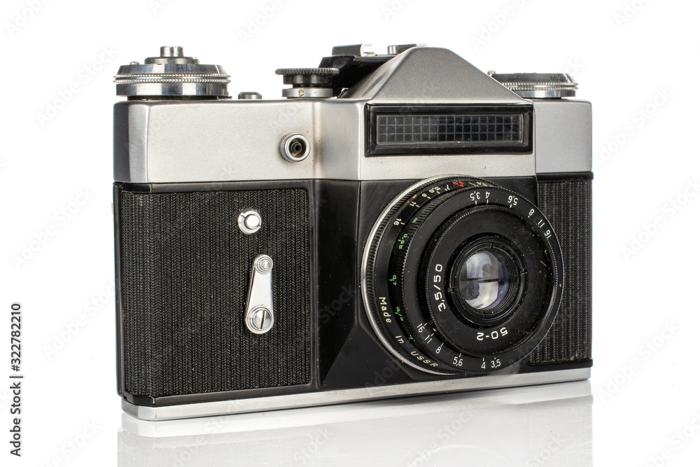 One whole silver vintage camera isolated on white background