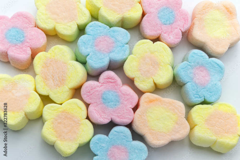 Pastel sweet flowers shape of marshmallows on white background. Pastel sweet flowers shape of marshmallows on white background.