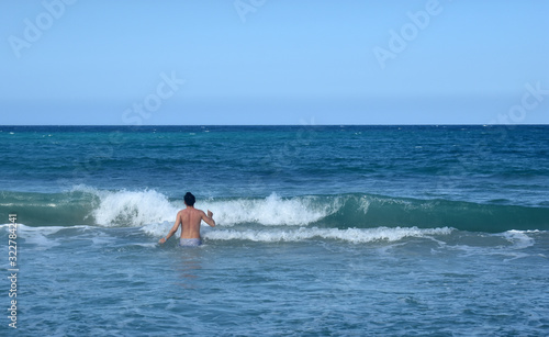 the guy is swimming in the Atlantic ocean. Dominican Republic