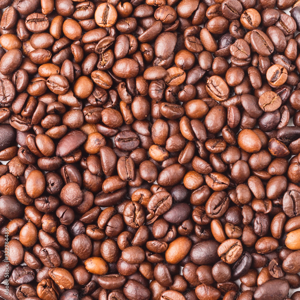 The texture of the coffee beans. A close-up. The texture of the coffee beans. A close-up.