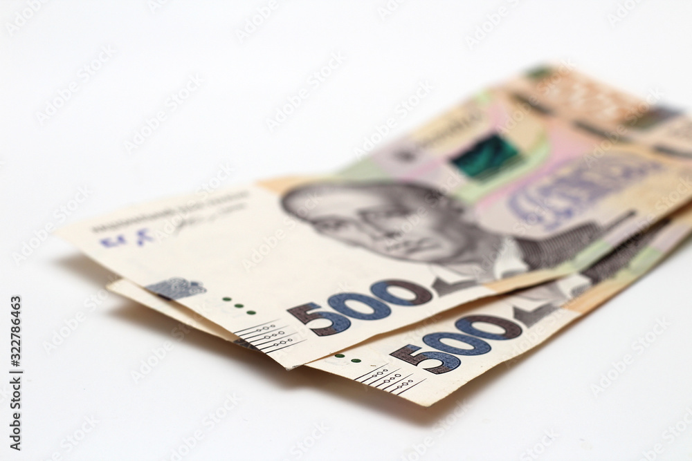 Two new banknotes in denominations of 500 Ukrainian hryvnias isolated on a white background with shadow. European money exchange. Ukraine currency Two new banknotes in denominations of 500 Ukrainian hryvnias isolated on a white background with shadow. European money exchange. Ukraine currency
