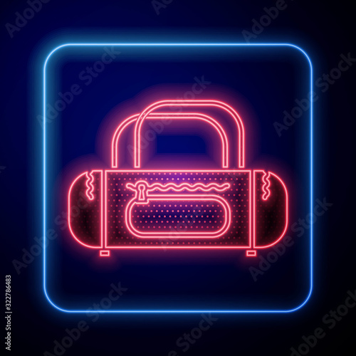 Glowing neon Sport bag icon isolated on blue background.  Vector Illustration