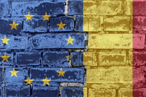 The flag of the European Union and Romania on a brick wall