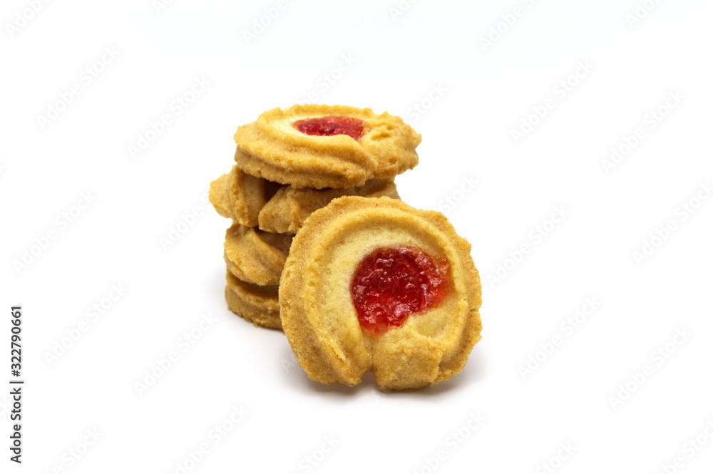 Butter cookies strawberry jam topping and sweet flavored and pile of biscuits cracker homemade on white background.