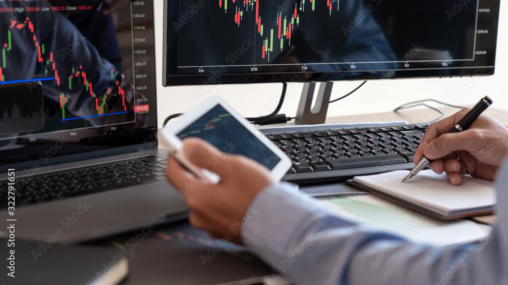 Businessman broker Analyzing finance data graphs and reports on screen for investment purposes for trading graph of stock market. Businessman broker Analyzing finance data graphs and reports on screen for investment purposes for trading graph of stock market.