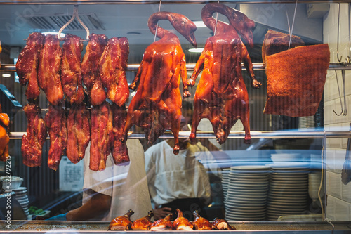 Roasted ducks, peking duck and roast goose, a common picture in restaurant window of Hong Kong photo