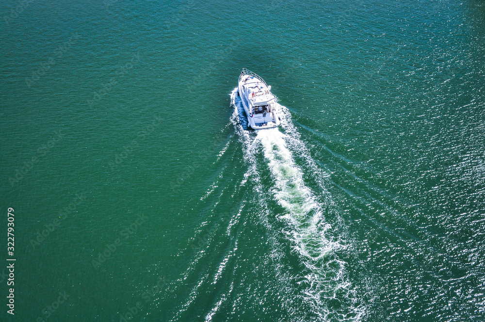White Boat scatters waves . The best direction for the summer vacation