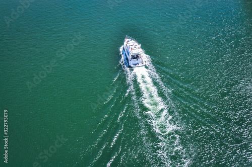 White Boat scatters waves . The best direction for the summer vacation © Elena