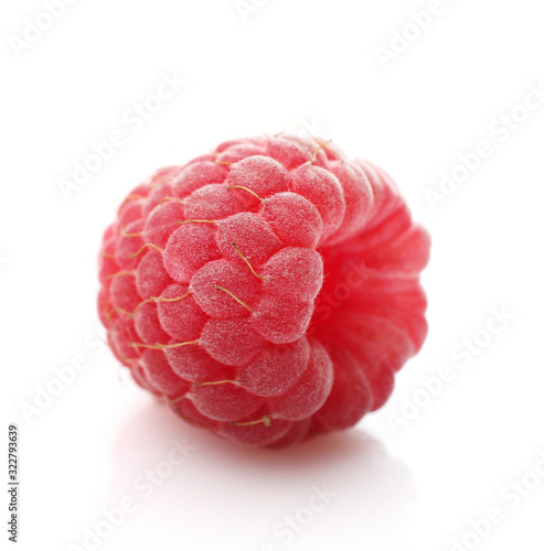 Red ripe raspberry isolated on white background