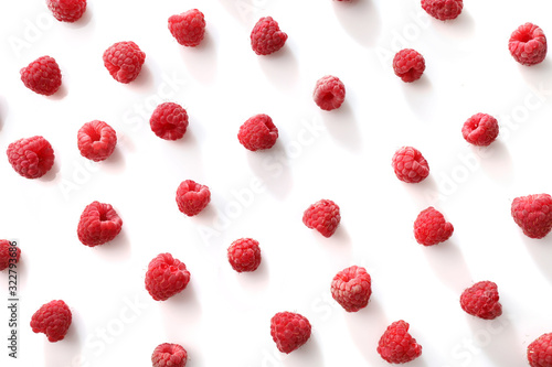Texture of red ripe raspberries isolated on white background