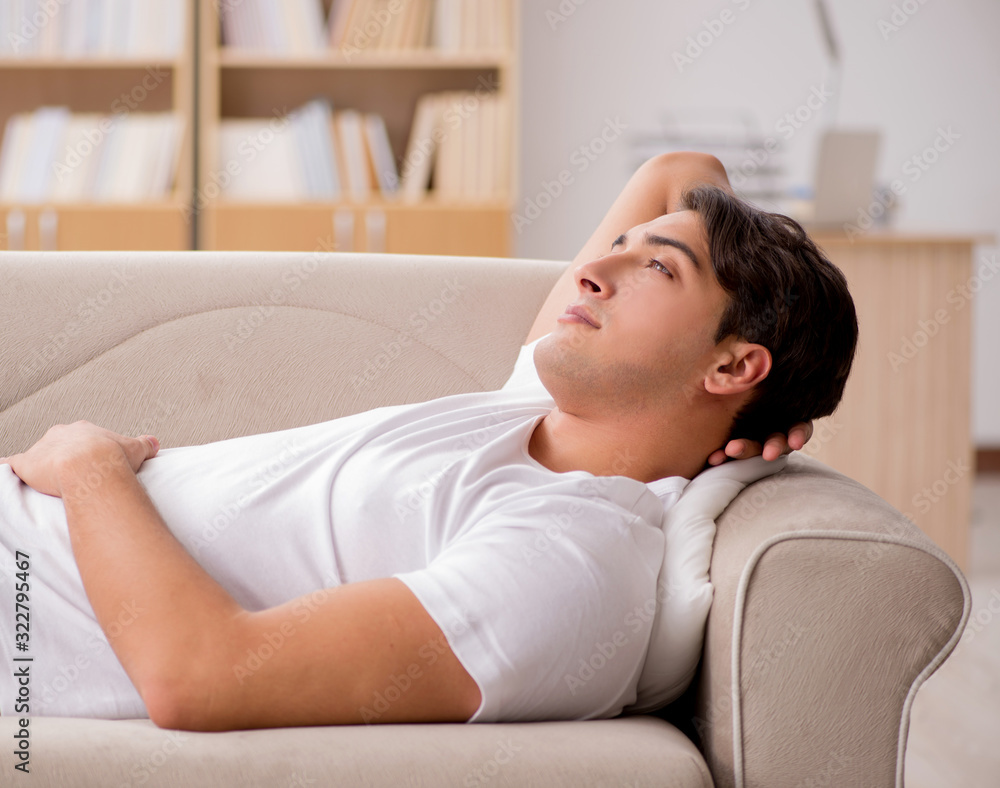 Young man sleeping in sofa couch Young man sleeping in sofa couch