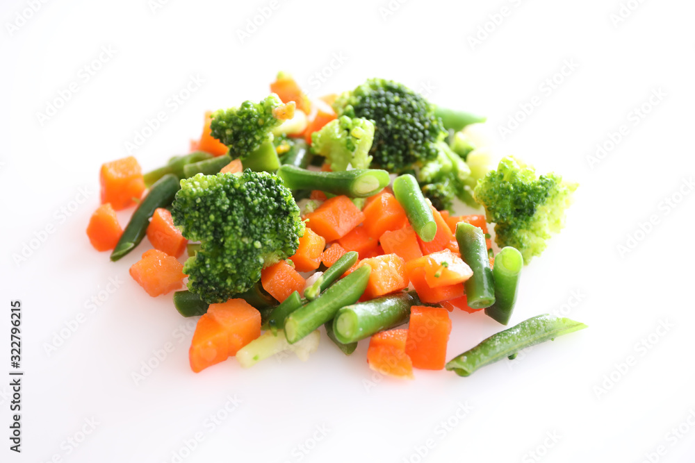 Frozen vegetables isolated on white background