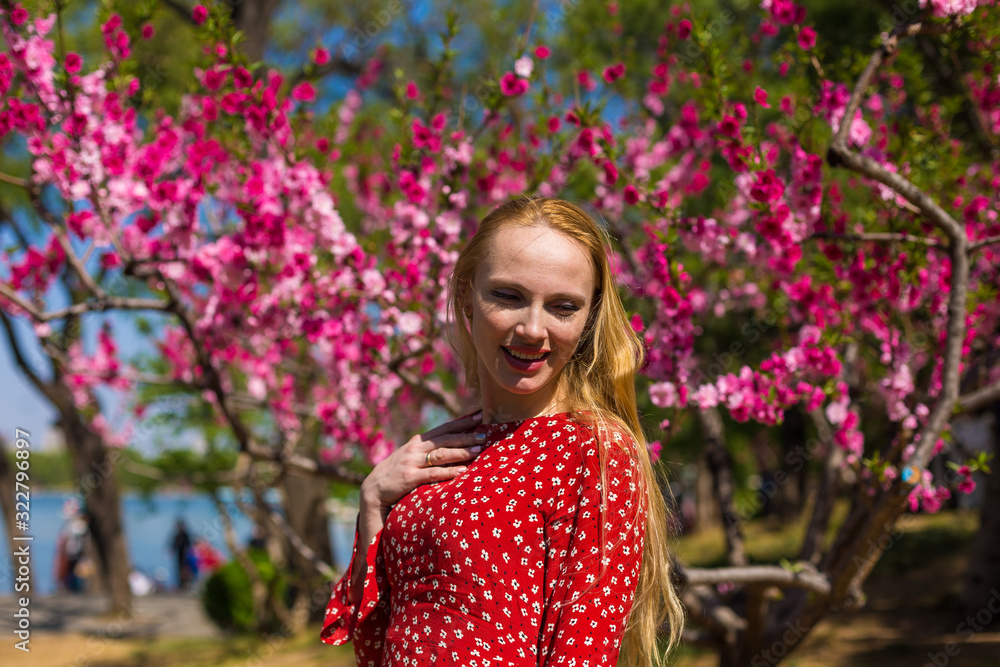 Blonde model in sakura garden 