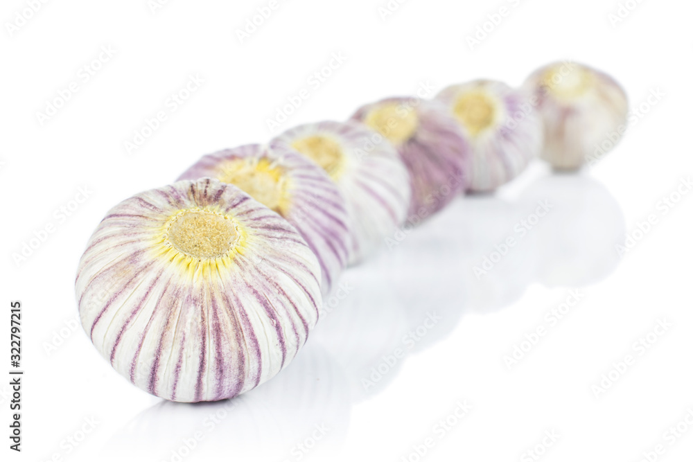 Lot of whole fresh purple single clove garlic isolated on white background Lot of whole fresh purple single clove garlic isolated on white background