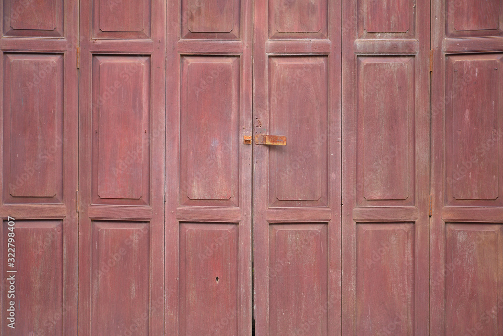 Old wooden vintage door painted in brown