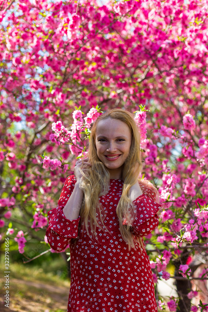 Blonde model in sakura garden Blonde model in sakura garden