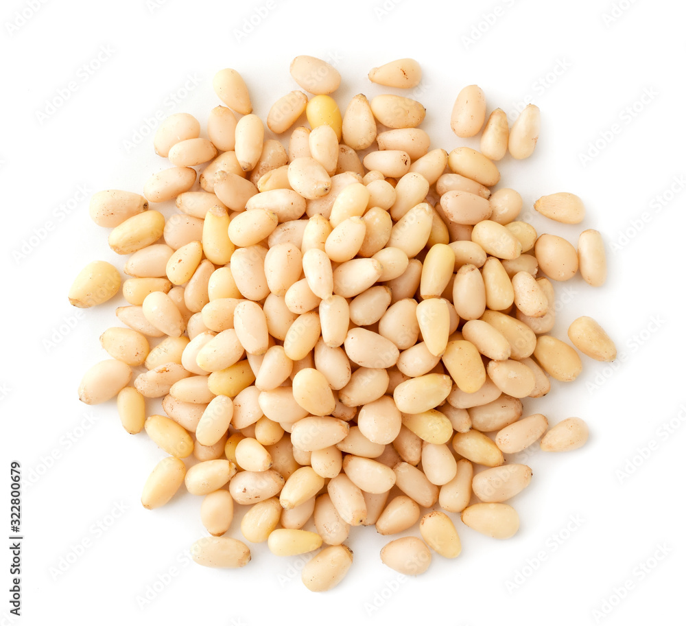 Pile of pine nuts on a white, isolated. The view of the top. Pile of pine nuts on a white, isolated. The view of the top.